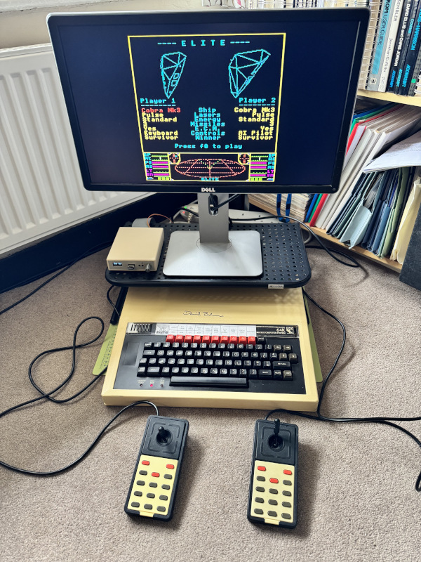 Playing two-player Elite with twin Delta 14B joysticks on a BBC Micro B+ signed by David Braben