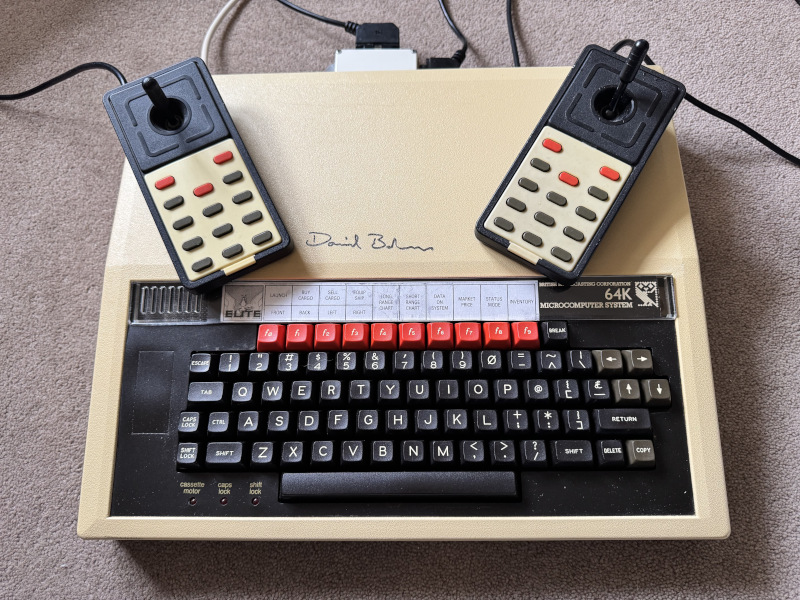 Two Delta 14B joysticks and a BBC Micro B+ signed by David Braben